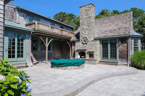 70 Vineyard Road Cotuit, MA 02635 - Photo 13 of 15 a front view of a house with garden and plants