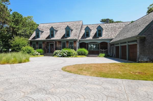 70 Vineyard Road Cotuit, MA 02635 - Photo 2 of 15 a front view of a house with a yard
