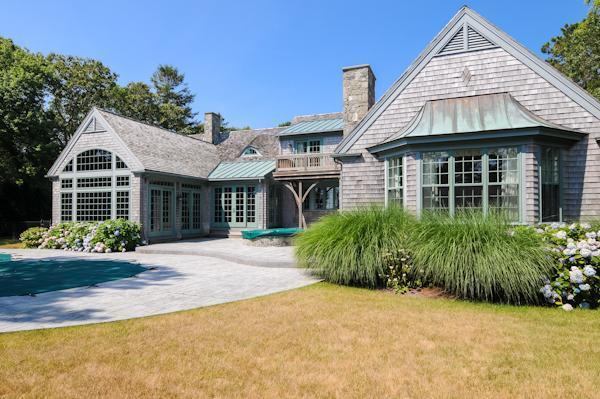 70 Vineyard Road Cotuit, MA 02635 - Photo 3 of 15 a front view of a house with a garden