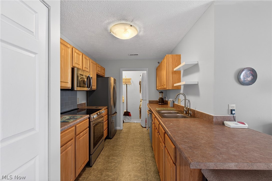 4703 Hills And Dales Road Northwest Canton, OH 44708 - Photo 9 of 25 laundry room with pocket door off kitchen