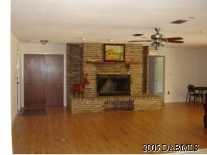 1969 Taylor Road Port Orange, FL 32128 - Photo 3 of 7 a view of a livingroom with a fireplace and window