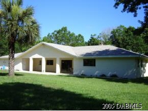 1969 Taylor Road Port Orange, FL 32128 - Photo 4 of 7 a front view of house with yard and green space