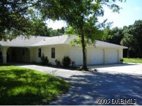 1969 Taylor Road Port Orange, FL 32128 - Photo 7 of 7 a front view of a house with a yard and garage