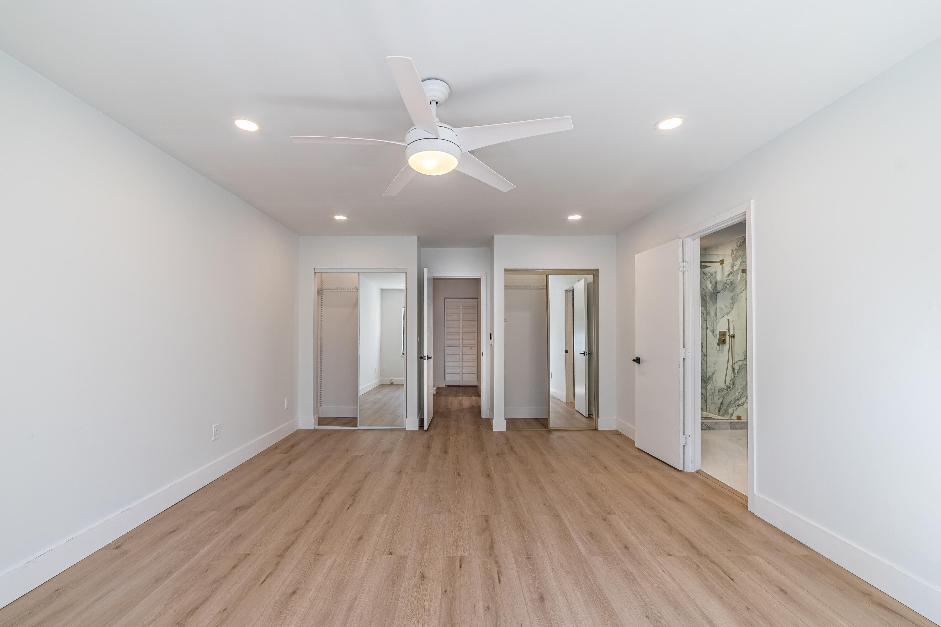 21864 Arriba Real, Unit 3E Boca Raton, FL 33433 - Photo 13 of 32 a view of an empty room with wooden floor