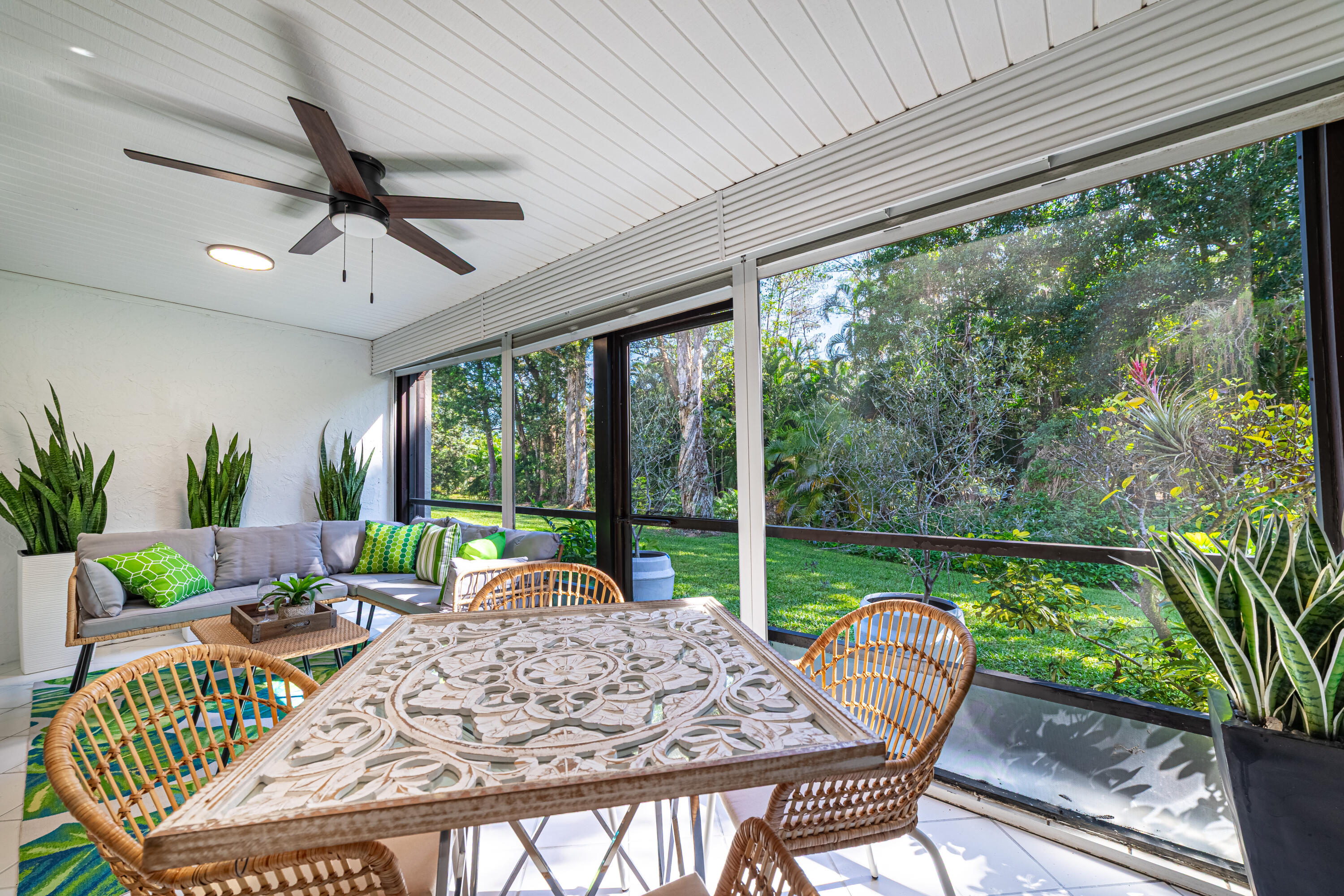 21864 Arriba Real, Unit 3E Boca Raton, FL 33433 - Photo 10 of 32 a view of a patio with a table chairs and a swimming pool