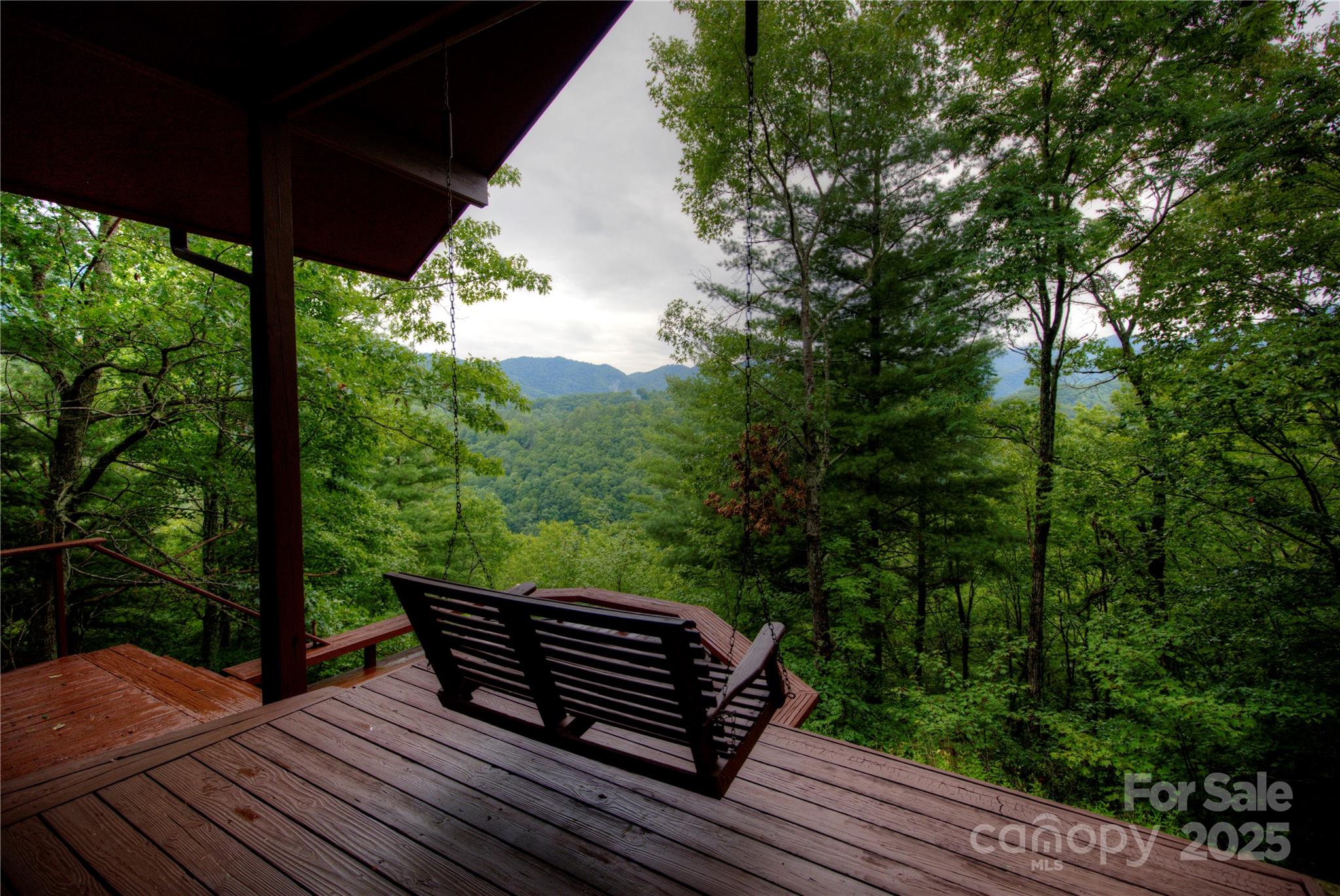 565 Silver Ridge Road Bryson City, NC 28713 - Photo 16 of 38 a view of a roof deck with wooden floor and fence