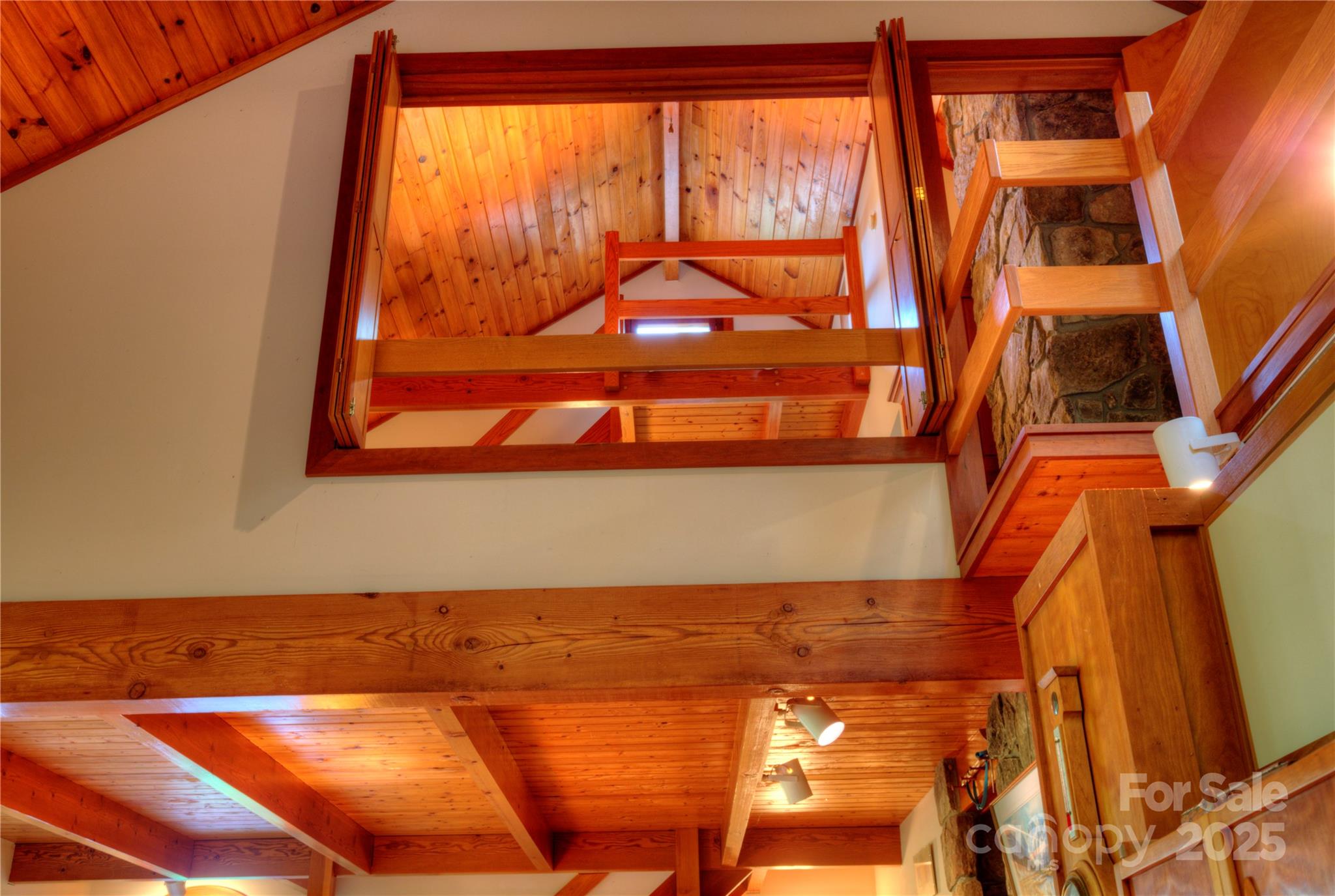 565 Silver Ridge Road Bryson City, NC 28713 - Photo 23 of 45 a view of a room with wooden floor and a large window