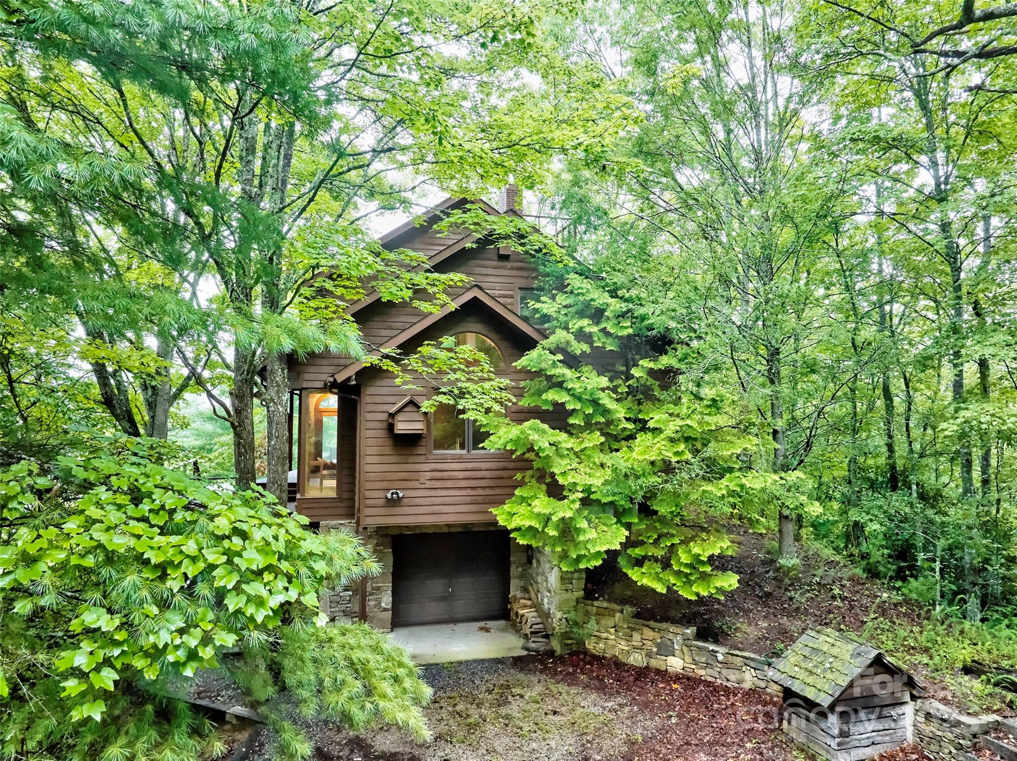 565 Silver Ridge Road Bryson City, NC 28713 - Photo 27 of 45 a backyard of a house with lots of green space