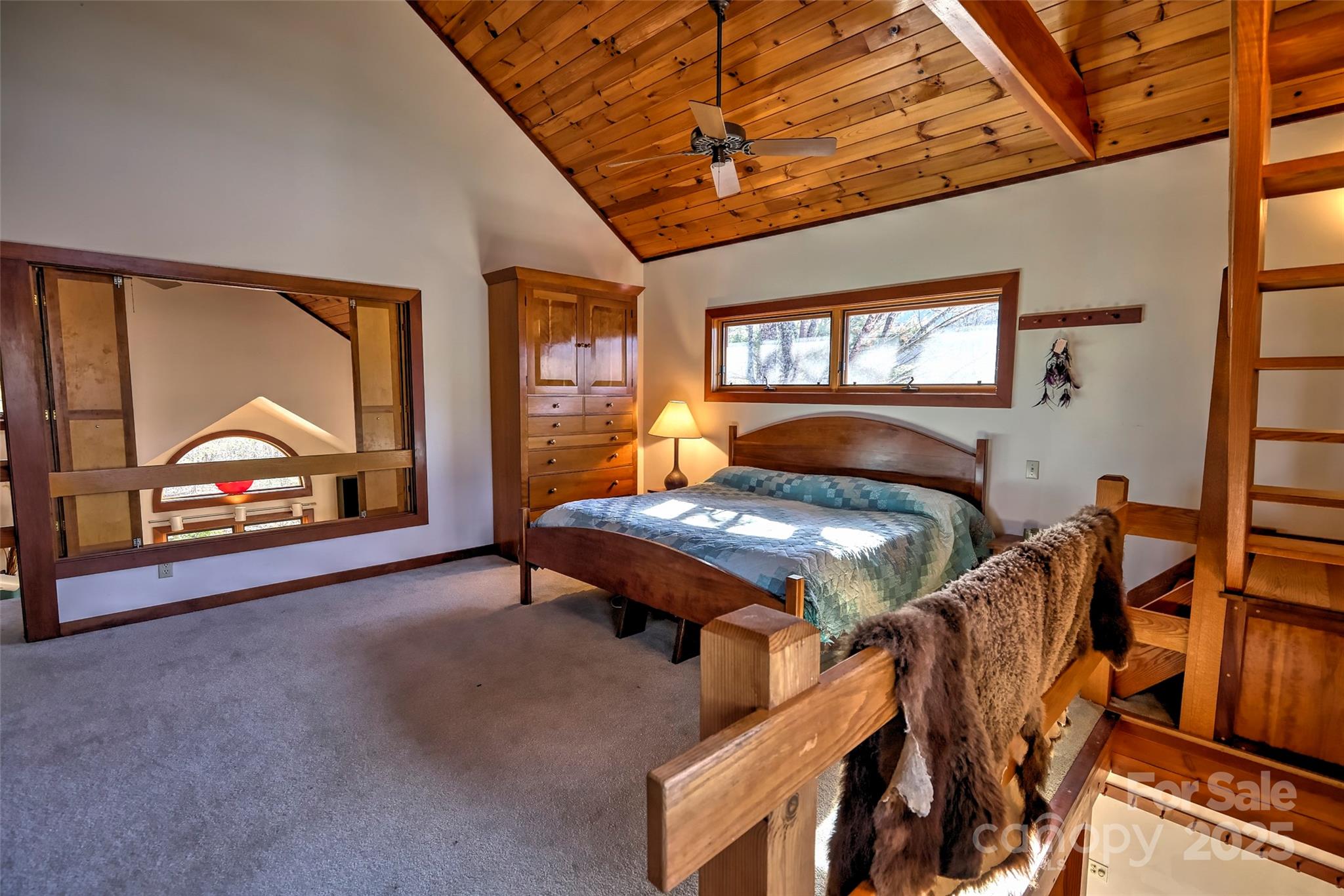 565 Silver Ridge Road Bryson City, NC 28713 - Photo 3 of 45 a bedroom with furniture and a window