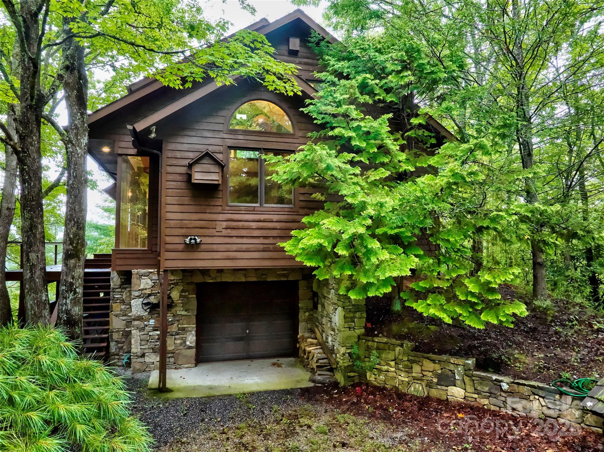565 Silver Ridge Road Bryson City, NC 28713 - Photo 33 of 38 a front view of a house with a garden