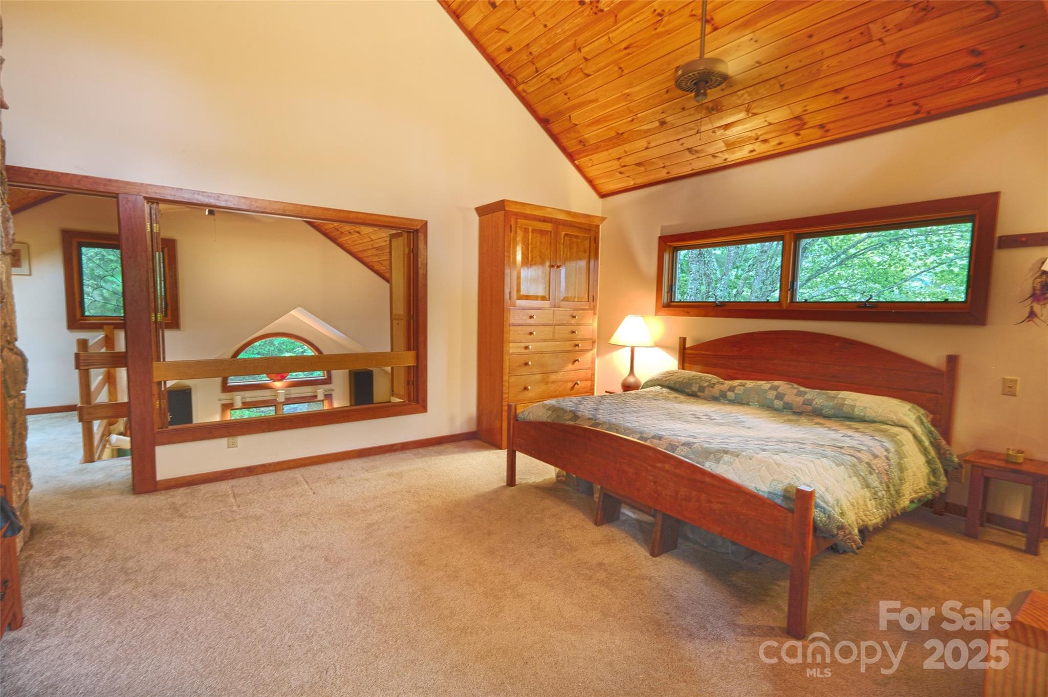 565 Silver Ridge Road Bryson City, NC 28713 - Photo 38 of 38 a spacious bedroom with a bed and a large window with outer view