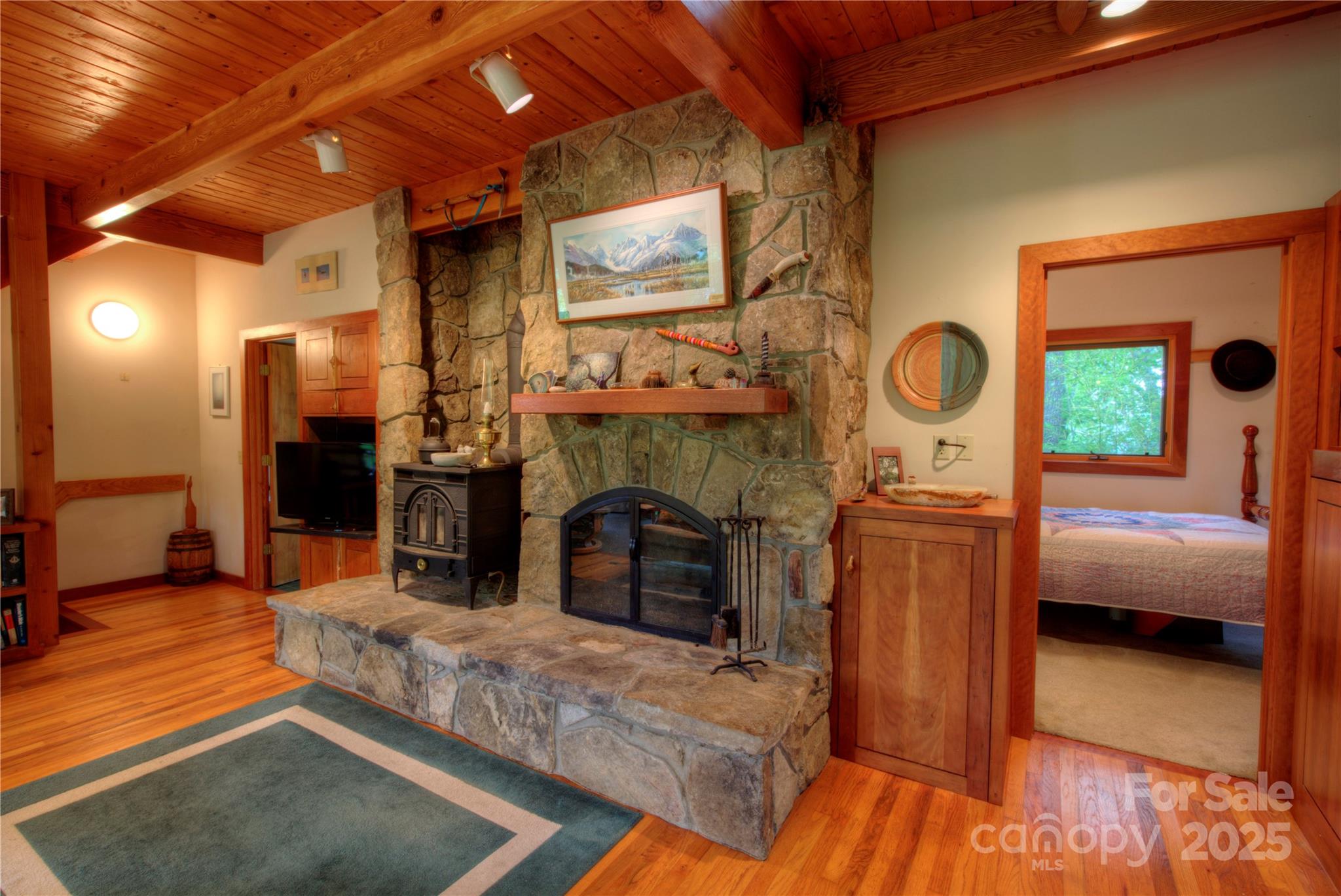 565 Silver Ridge Road Bryson City, NC 28713 - Photo 4 of 38 a living room with furniture and a fireplace