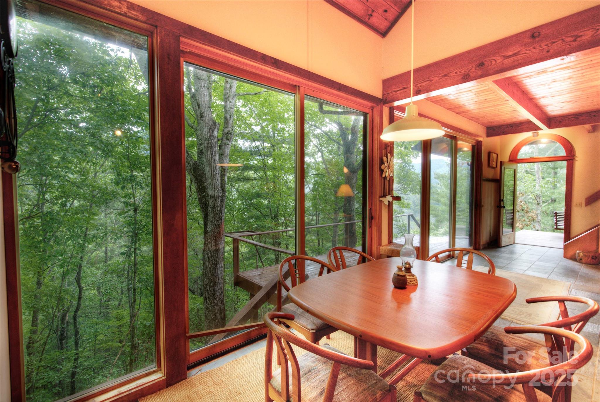 565 Silver Ridge Road Bryson City, NC 28713 - Photo 43 of 45 a view of a patio with a table chairs and a backyard