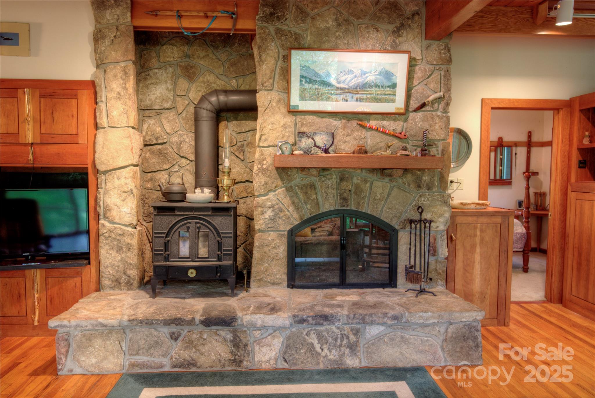 565 Silver Ridge Road Bryson City, NC 28713 - Photo 6 of 38 a living room with furniture and a fireplace