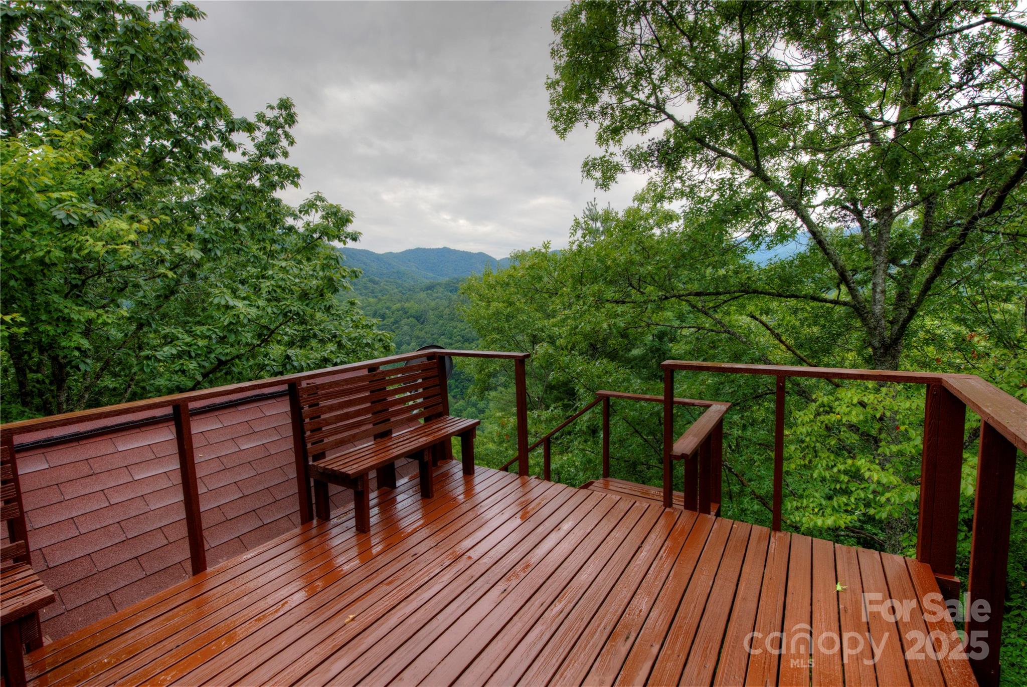 565 Silver Ridge Road Bryson City, NC 28713 - Photo 9 of 38 a wooden bench sitting on top of a wooden deck