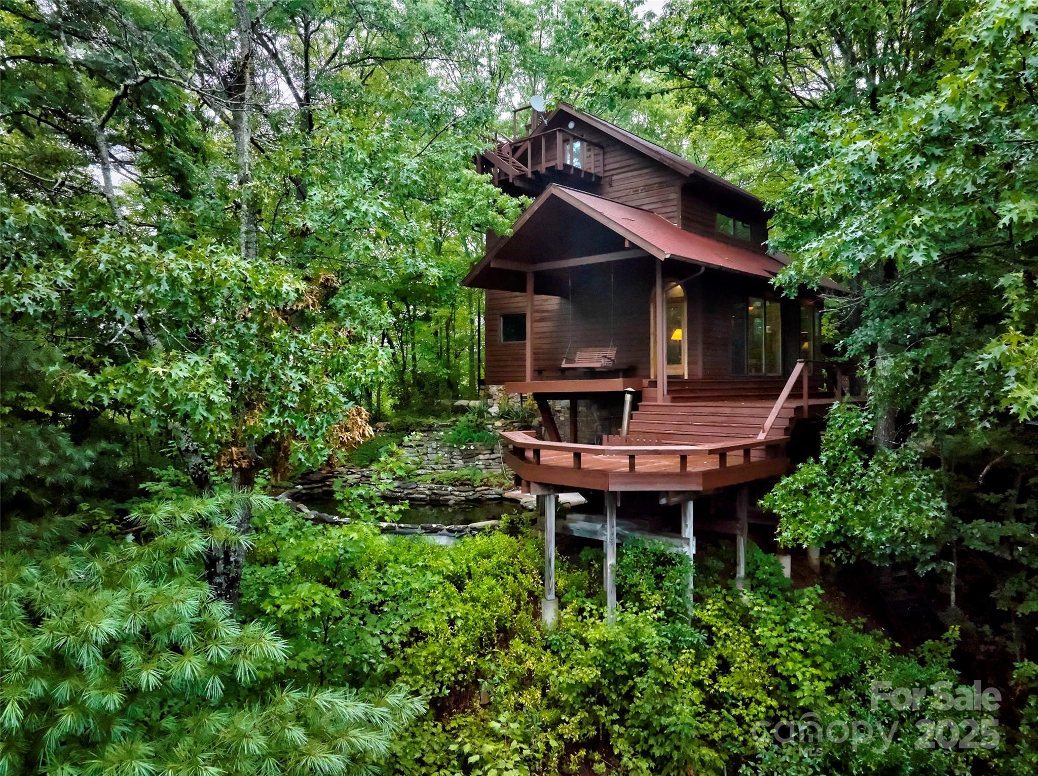 565 Silver Ridge Road Bryson City, NC 28713 - Photo 10 of 38 a backyard of a house with table and chairs
