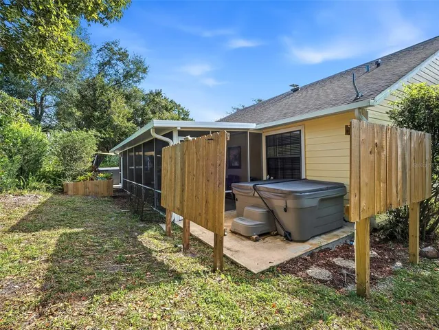 a outdoor room with chairs and a table