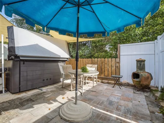 a view of a hallway with furniture and wooden floor