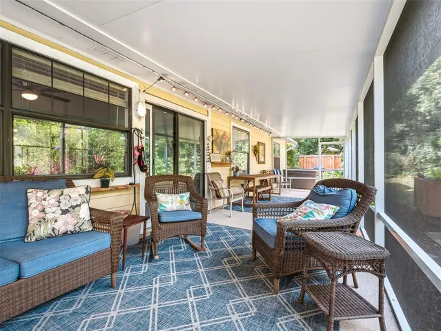 a large kitchen with kitchen island a counter top space a sink stainless steel appliances and cabinets