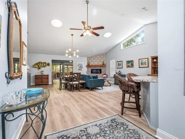 a bedroom with a bed a couch and a window