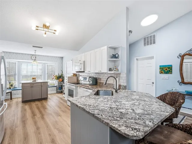 a bedroom with a bed and flat screen tv