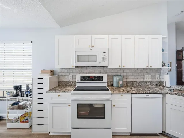 a workspace with furniture and window