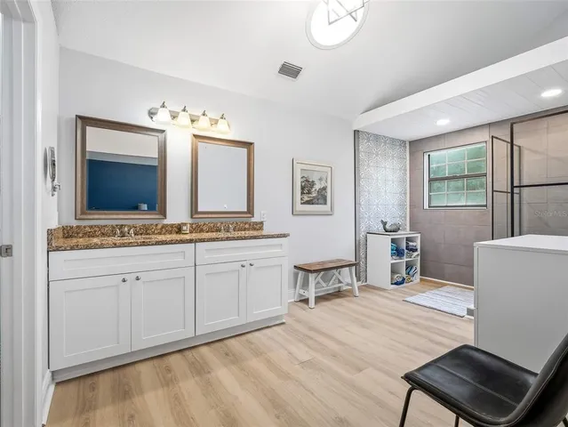 a workspace with furniture and wooden floor