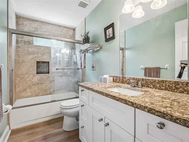 an aerial view of a house with a lake view