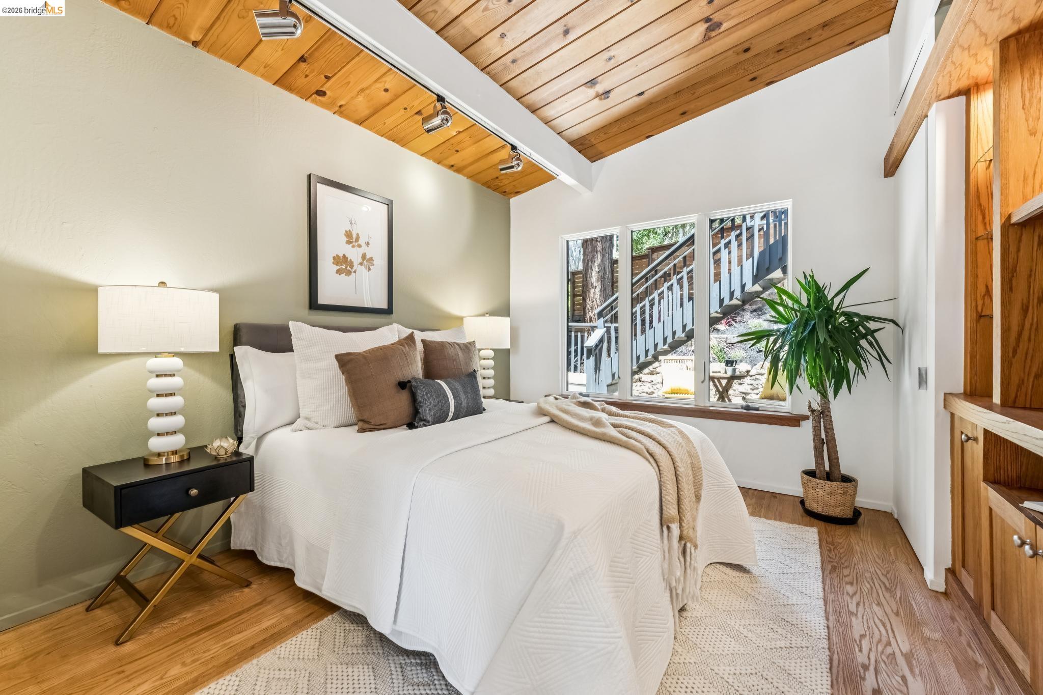 6645 Heather Ridge Way Oakland, CA 94611 - Photo 31 of 61 Vaulted wood-paneled ceiling with track lighting