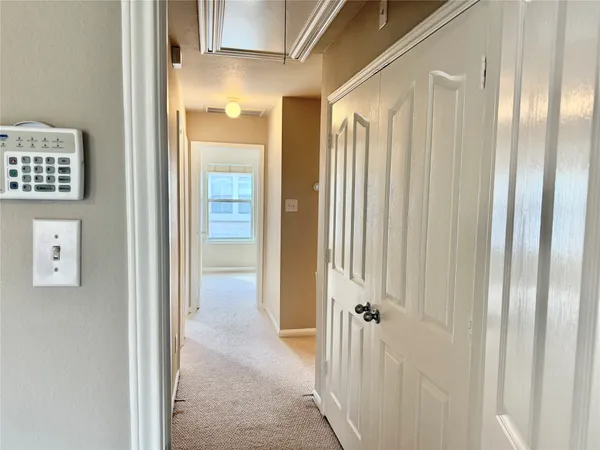 a view of a bathroom from the door