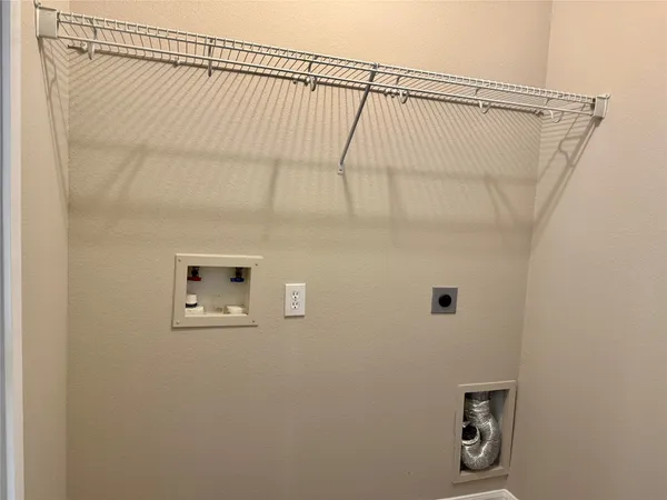 a bathroom with a shower and a window