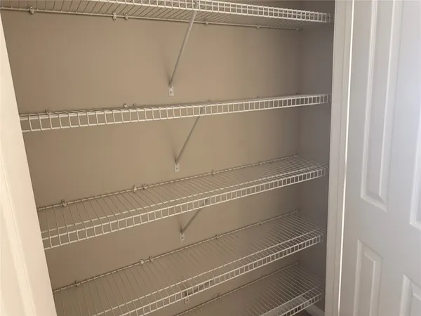 a close view of utility room with racks on the wall