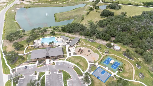 a view of a swimming pool with a patio