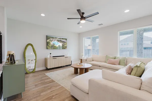 a living room with furniture and a large window