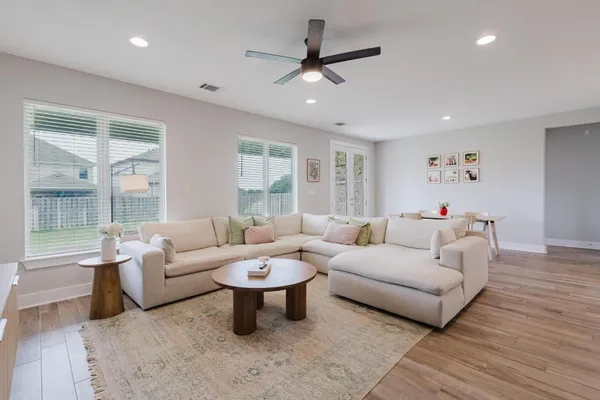 a living room with furniture and a large window