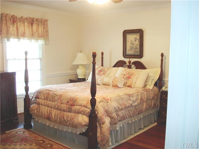 4083 Massengale Road Whitakers, NC 27891 - Photo 12 of 17 Master bedroom has hardwood floors and chair rail.
