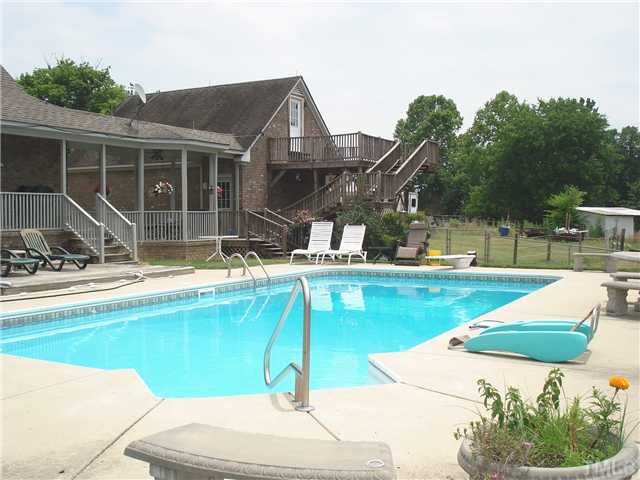 18 ' x 36' in-ground pool with concrete patio and deck area with hot tub.Entertaing guests is a breeze  with this set-up!!!