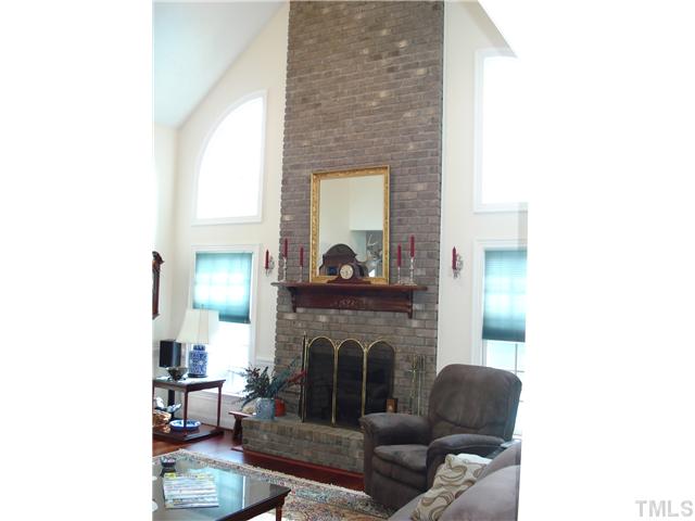 4083 Massengale Road Whitakers, NC 27891 - Photo 8 of 17 Very spacious greatroom with cathedral ceiling and huge brick fireplace....hardwood floors,nice space for family gatherings,