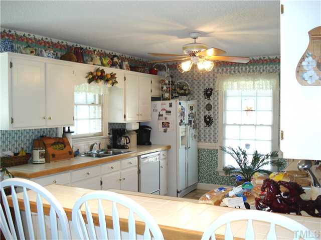 4083 Massengale Road Whitakers, NC 27891 - Photo 9 of 17 Big open kitchen w/ tile countertops and eat-on bar....lots of cabinets!!