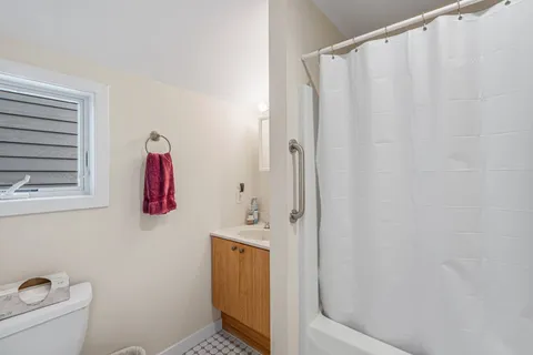 a bathroom with a shower curtain