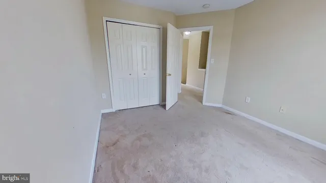a view of hallway with closet