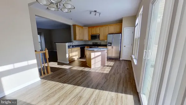 a kitchen with a sink appliances and cabinets