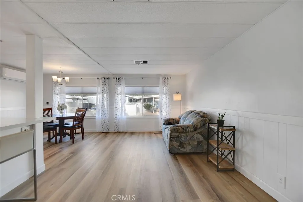 840 Foothill, Unit 27 Azusa, CA 91702 - Photo 9 of 30 a living room with furniture and a wooden floor