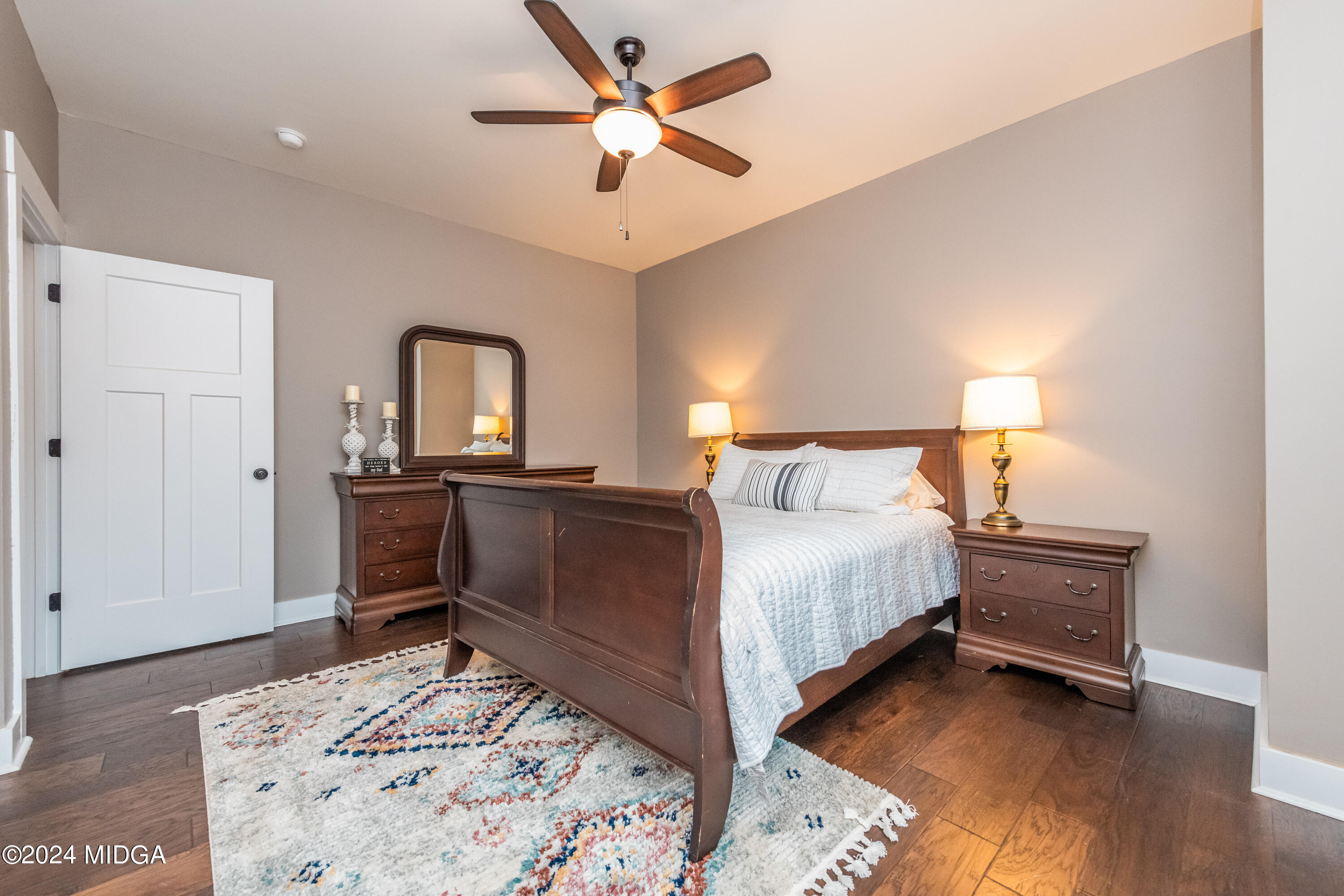 158 Harper Road Perry, GA 31069 - Photo 19 of 46 a bedroom with a bed and a dresser in it