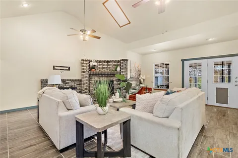 a living room with furniture and a table