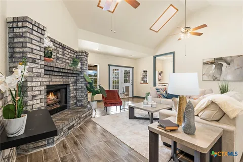 a living room with furniture and a fireplace