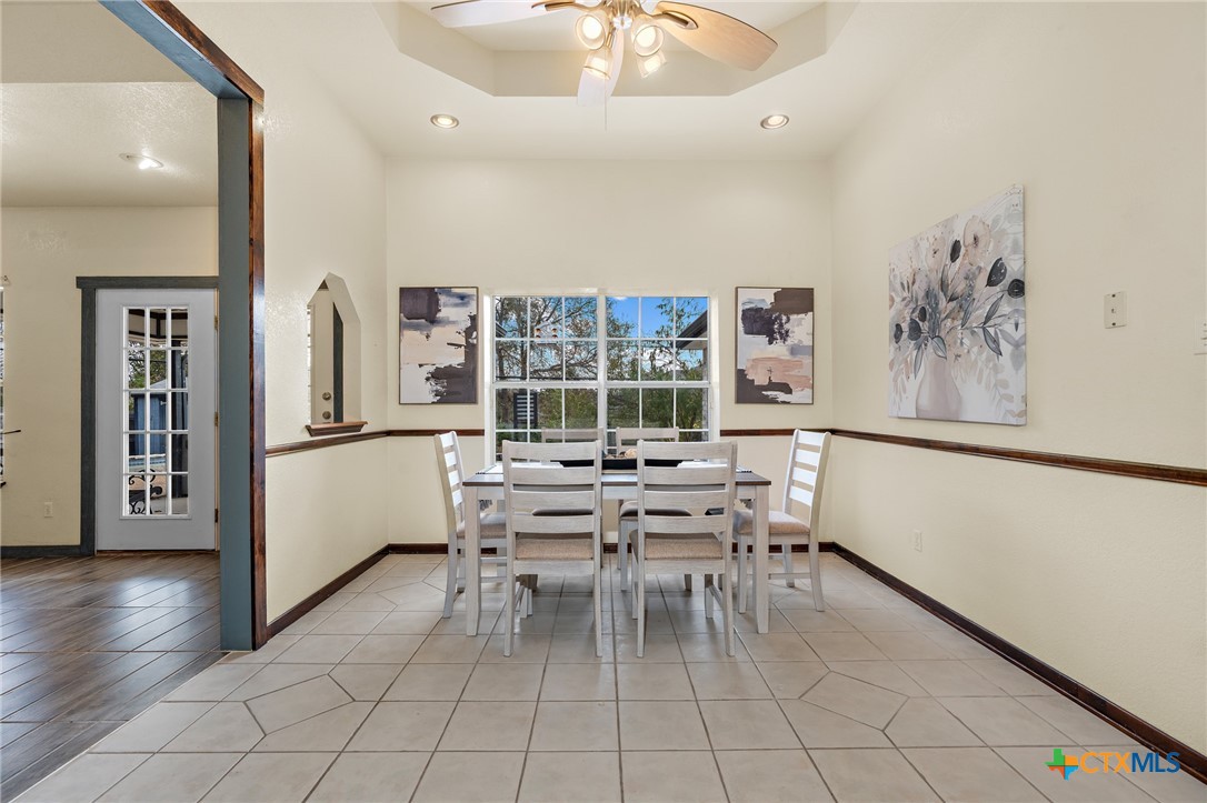 711 Mueller Street Copperas Cove, TX 76522 - Photo 15 of 48 a dining room with furniture and a floor to ceiling window