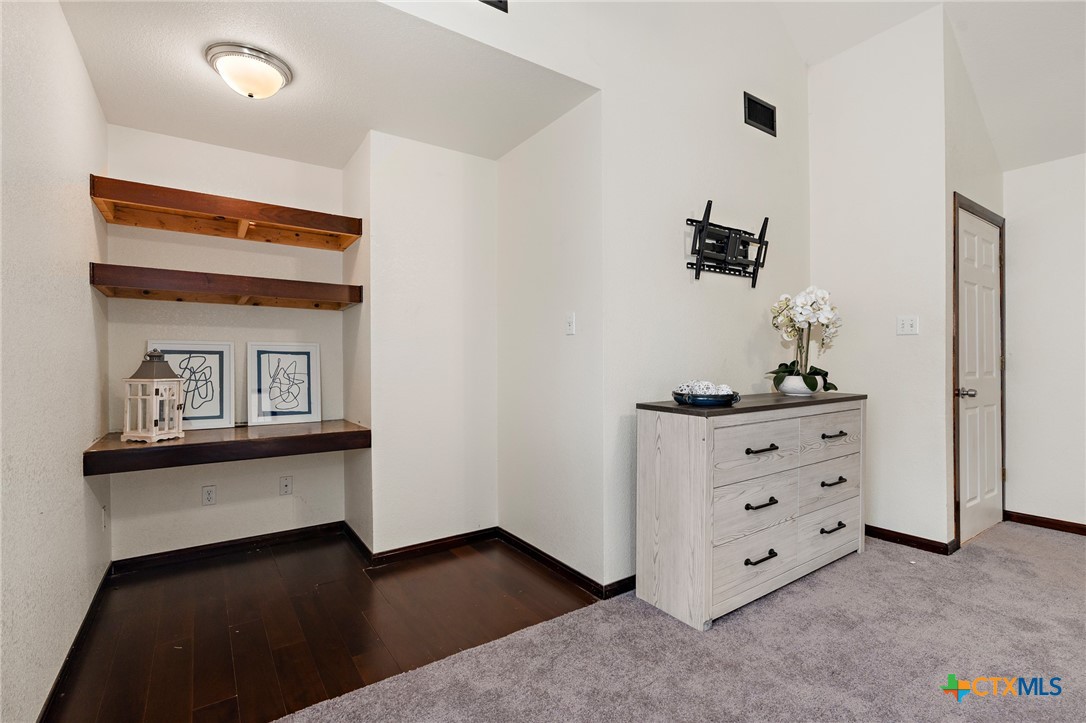 711 Mueller Street Copperas Cove, TX 76522 - Photo 21 of 48 a room with a dresser and a mirror