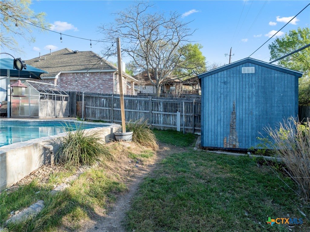 711 Mueller Street Copperas Cove, TX 76522 - Photo 43 of 48 a view of a backyard with a plants and wooden fence