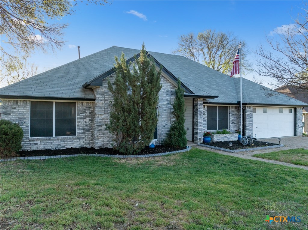 711 Mueller Street Copperas Cove, TX 76522 - Photo 5 of 48 a view of a backyard with a garden and plants